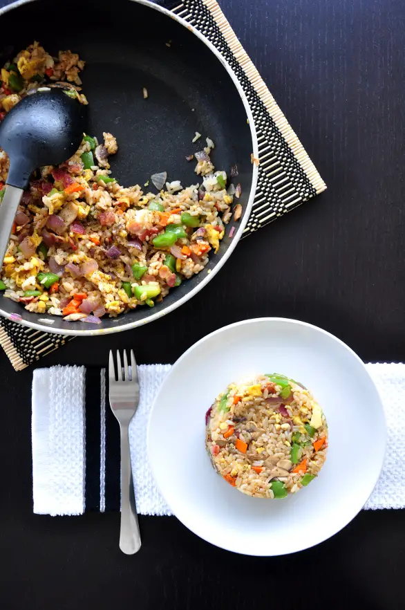 Unconventionally amazing fried rice made with loads of vegetables of your choice and the most classic western combination, bacon and eggs!