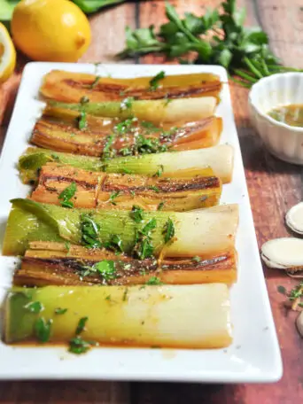 Leeks braised in butter, white wine, and chicken bone broth with fresh herbs and lemon juice. Absolutely unconventional, yet amazing!