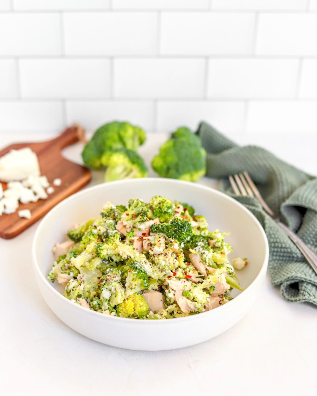 This quick and easy chicken broccoli salad is ready in 15 minutes. It's high-protein and nutrient-packed and is perfect for a workday lunch.  