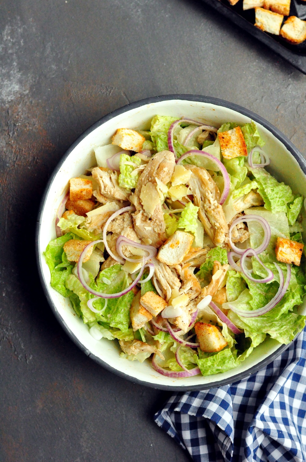 A delicious chicken salad recipe featuring the perfect shredded chicken, crunchy croutons, and a creamy tahini dressing.  