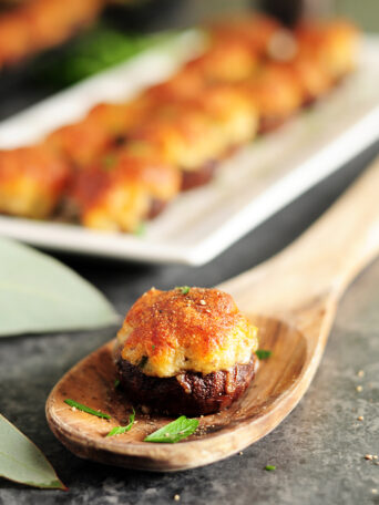 Gluten-free crab filling stuffed into mushrooms and covered with a blanket of cheese, these crab stuffed mushrooms are amazing for a crowd or just for you.