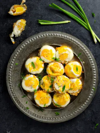 Eggs and Cheese baked with tater tots in a muffin pan, those tater tot cups are great breakfast and they are easy to make. Watch the video to learn how.