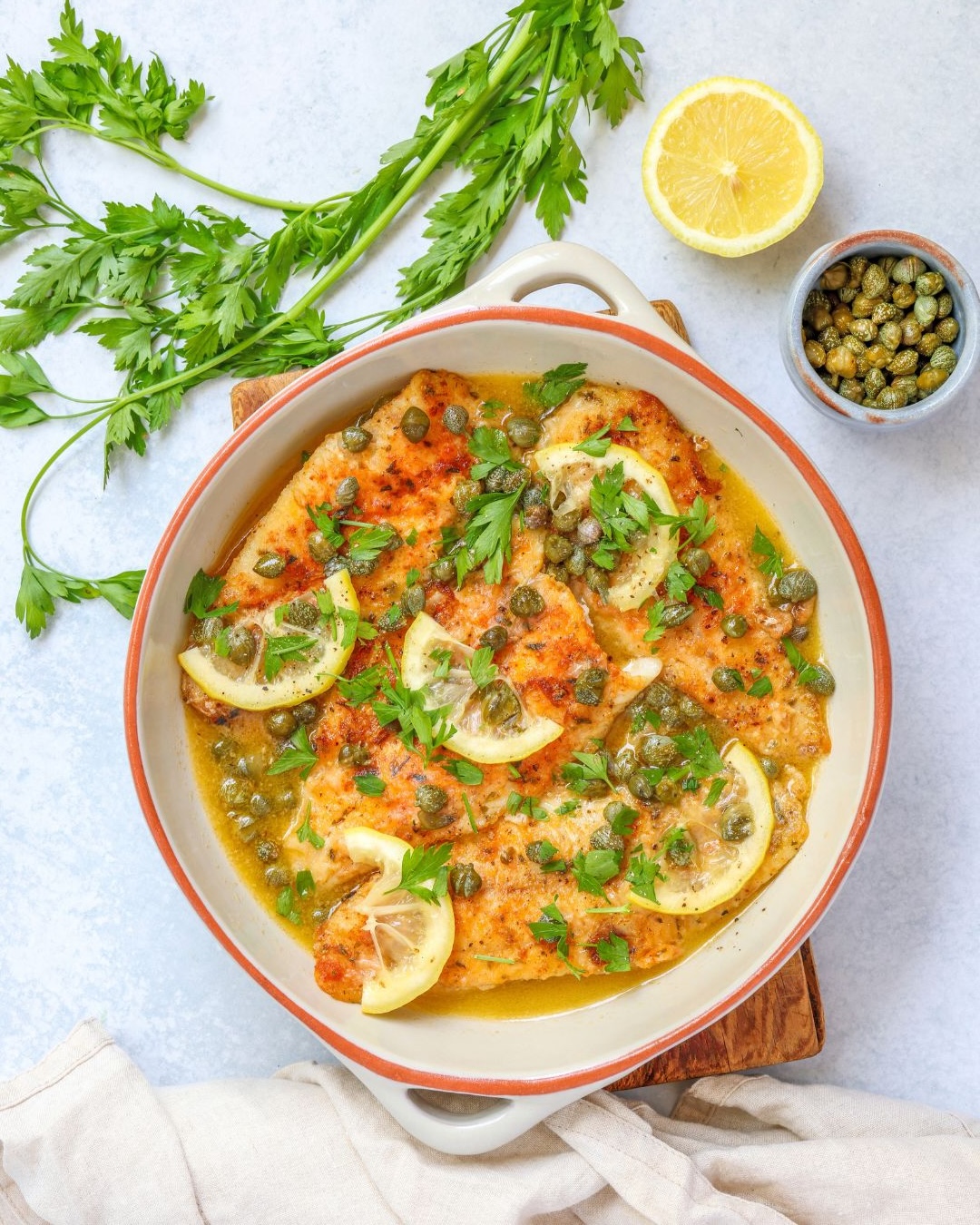 This super easy fish piccata is made with well-seasoned thin white fish fillets in a delicious pan sauce. It's ready in 20 minutes.