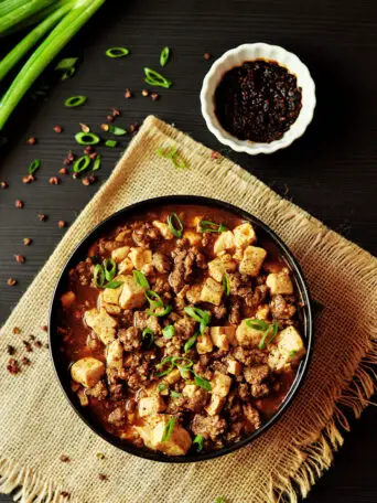 Traditional Mapo Tofu made easy and gluten-free with homemade hot chili oil and pepper solids, then simmered in hearty bone broth!