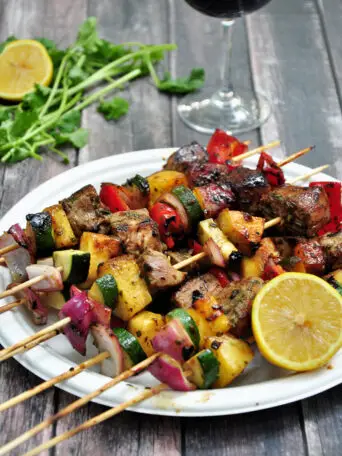 Grilled tuna, red onions, bell peppers, pineapples and zucchini on skewers, these tuna kabobs are basted and served with an amazing pineapple glaze. Yum!