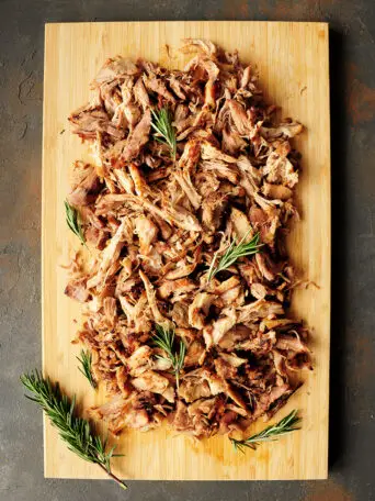 Sous vide pork shoulder cooked to fork tender without babysitting. This pulled pork recipe makes any main dish hearty, flavorful, and satisfying.