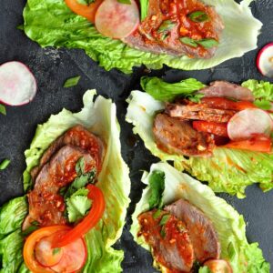 These Korean Beef Lettuce Wraps are made with sous vide beef cheeks or leftover steak coated in a tantalizing Korean bulgogi sauce nestled in crisp lettuce leaves.