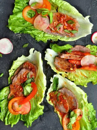 These Korean Beef Lettuce Wraps are made with sous vide beef cheeks or leftover steak coated in a tantalizing Korean bulgogi sauce nestled in crisp lettuce leaves.