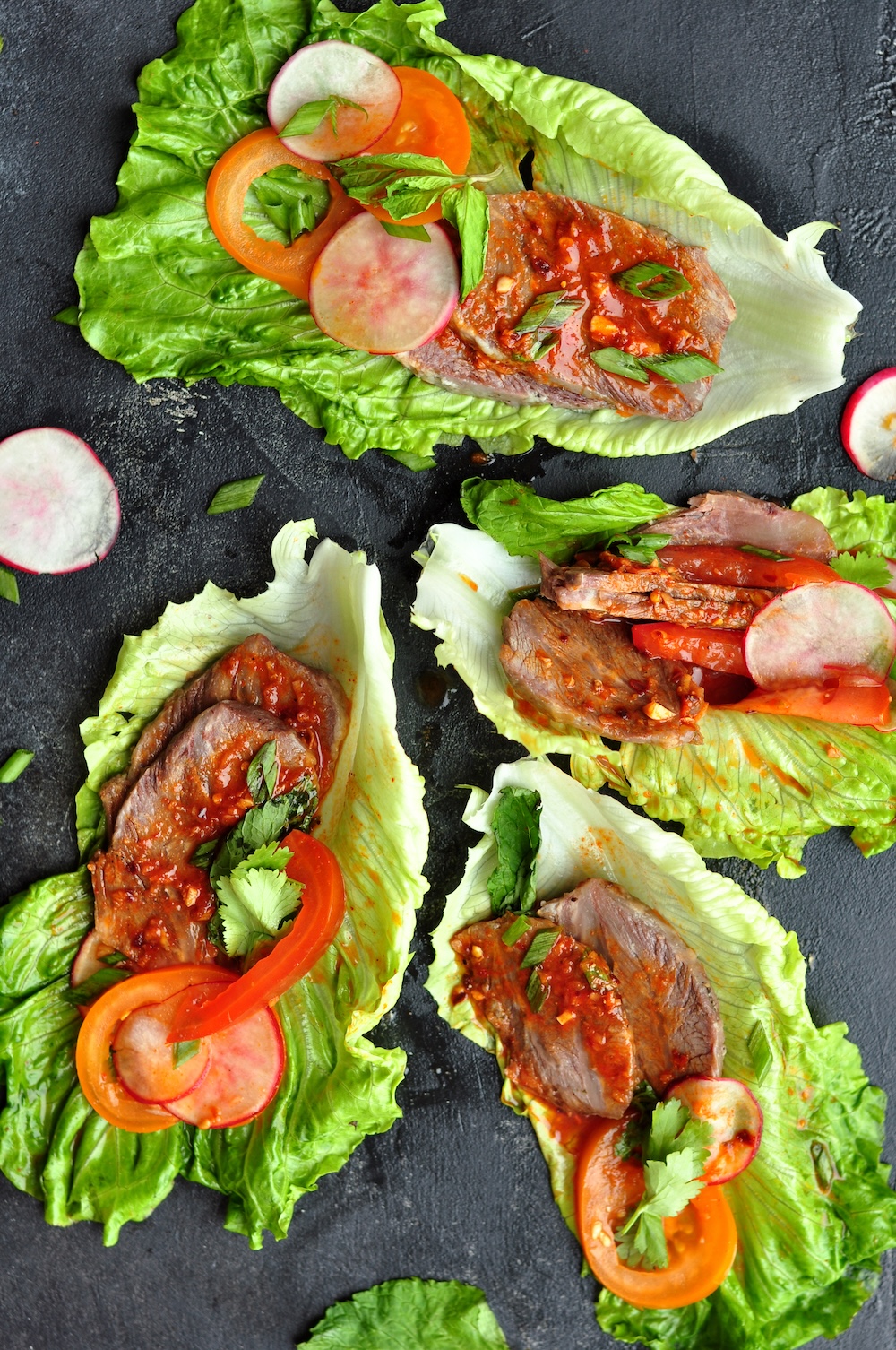 These Korean Beef Lettuce Wraps are made with sous vide beef cheeks or leftover steak coated in a tantalizing Korean bulgogi sauce nestled in crisp lettuce leaves. 