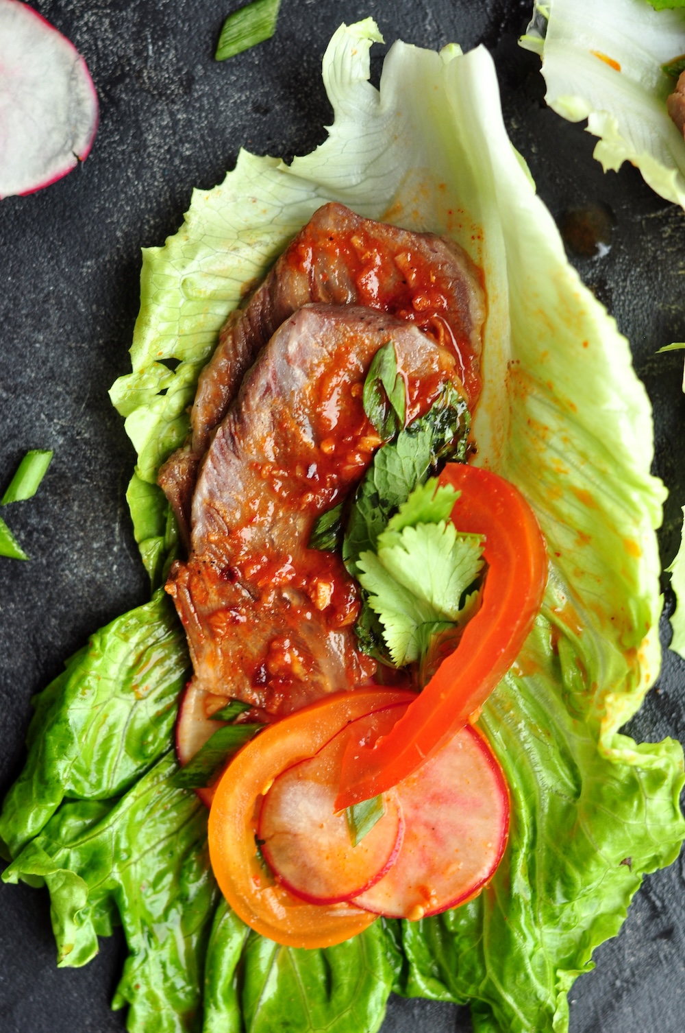 These Korean Beef Lettuce Wraps are made with sous vide beef cheeks or leftover steak coated in a tantalizing Korean bulgogi sauce nestled in crisp lettuce leaves.