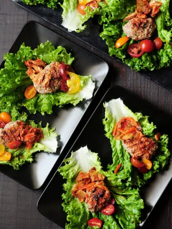 Easy lettuce wraps featuring grilled ground beef patties and kimchi. It takes less than 30 minutes to put this delicious Korean-style appetizer on the table.