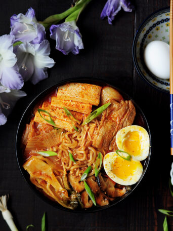 This epic kimchi ramen features pork belly, shiitake mushrooms, bok choy, tofu, and kimchi! The best part is that it's one pot and only takes 30 minutes!