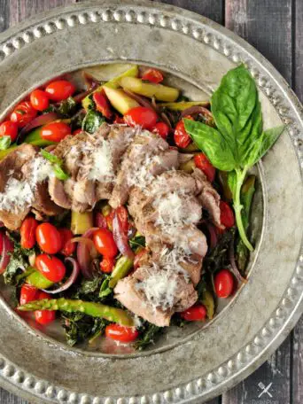 Pork over Warm Kale and Asparagus Salad