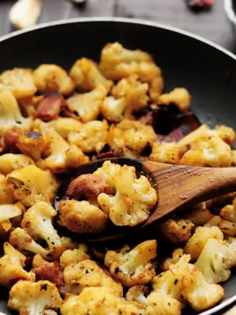 An easy recipe with only 7 ingredients like this sautéed cauliflower with bacon is perfect for any busy workday dinner. It’s a little spicy, gluten-free and so delicious that you won’t want to stop digging in.