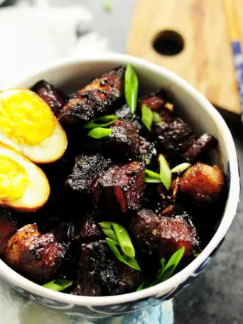 Authentic Shanghai-style braised pork belly simmered in rich and dark soy sauce and Chinese cooking wine, caramelized with brown sugar along with fresh ginger, garlic, green onion, and star anise. This is a true Chinese dish you can make in your own kitchen.