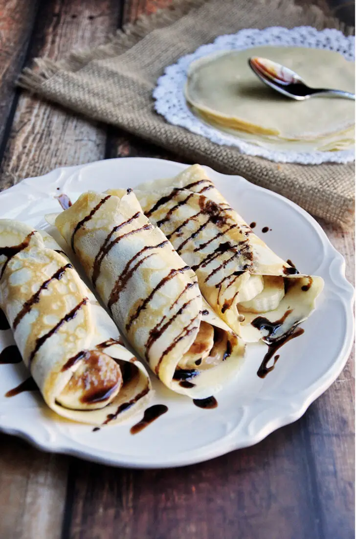 Simple crepes made from scratch and filled with peanut butter and banana then drizzled with chocolate syrup.