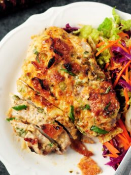 Baked pork chops covered in a smoky bacon and cheese mixture, with a simple vegetable slaw, you can wrap up this gluten-free and low-carb meal in 2