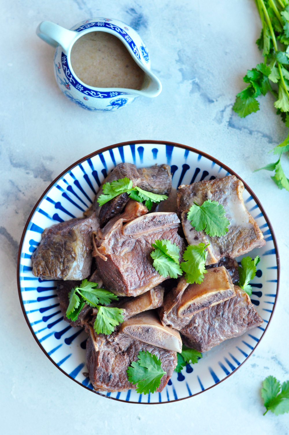 Sous vide beef short ribs slow-cooked in a gluten-free soy-coconut sauce with garlic, star anise, and bay leaves for a unique Asian flavor.