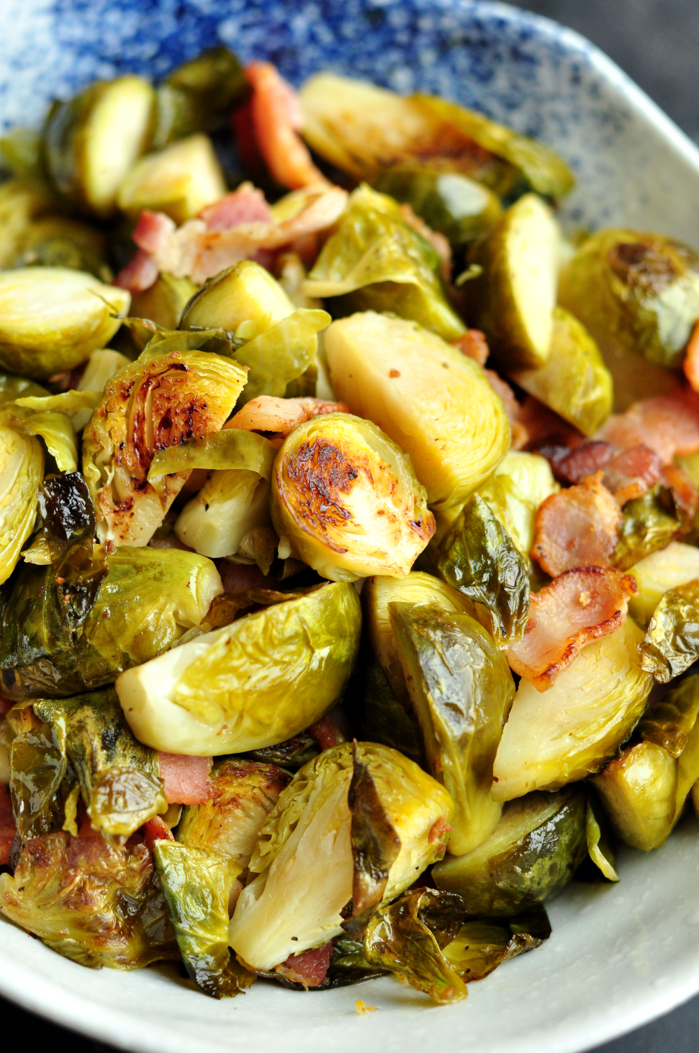 Sous vide Brussels sprouts cooked with bacon in garlic-infused bacon fat. It's a delicious match made in heaven.