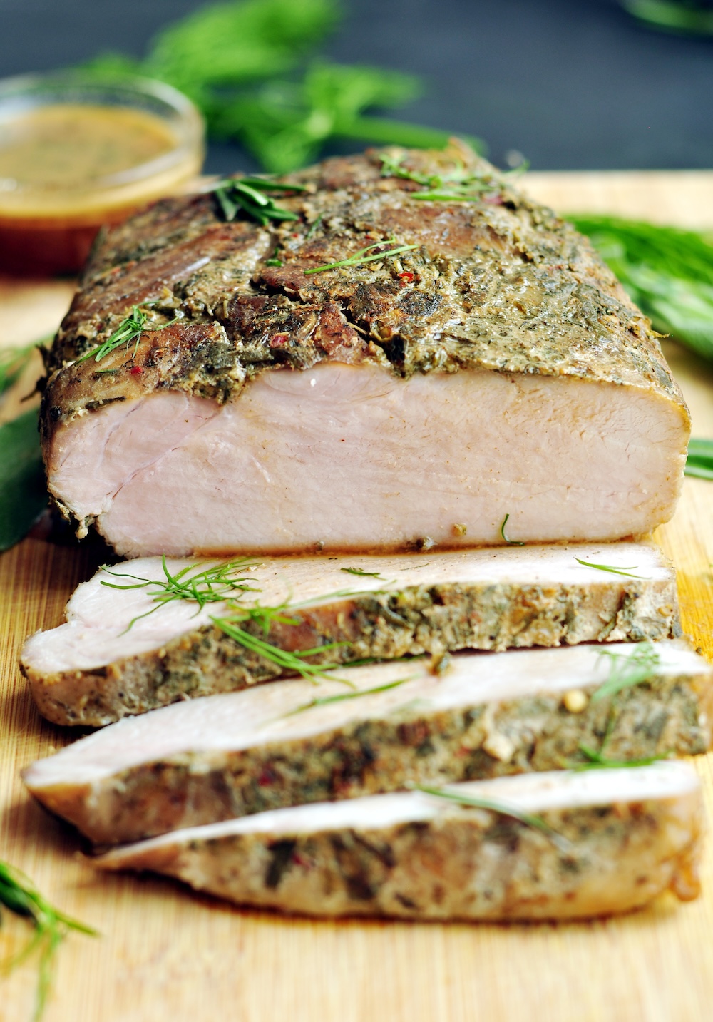 This sous vide pork loin roast is a foolproof way to make a restaurant-quality meal at home easily. The green garlic-herb marinade is a must-try with pork.