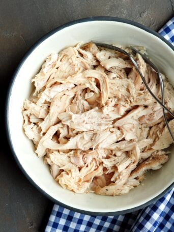 Sous vide shredded chicken is a set-and-forget way to guarantee your pulled chicken is perfect, juicy, and tender every time.