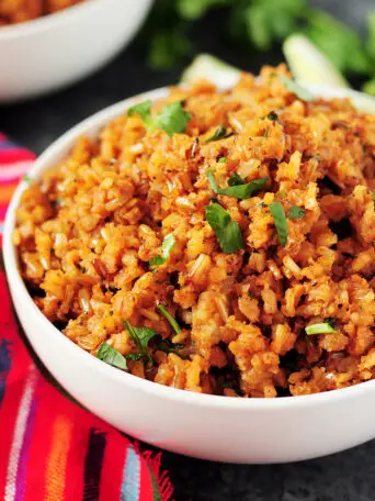 A detailed step-by-step guide on how to make Mexican rice that's authentic, healthy, and addictive every single time. Recipe included.