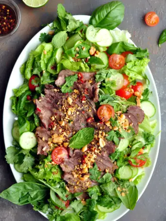 This authentic Thai beef salad uses any cooked steak, so it's super quick to put together. It's gluten-free with no added sugar but bold flavors.