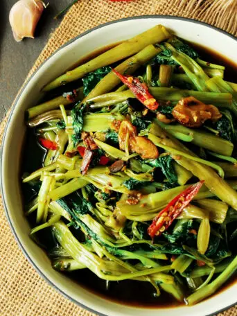 Cook one of the most popular Thai dishes at home with this tasty stir-fry morning glory (water spinach recipe.) It’s super quick and vegan-friendly.